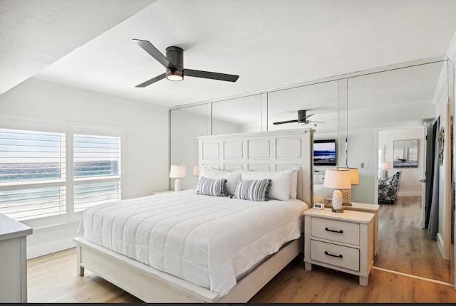 bedroom with ceiling fan and hardwood / wood-style floors