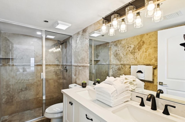 bathroom featuring toilet, an enclosed shower, and vanity