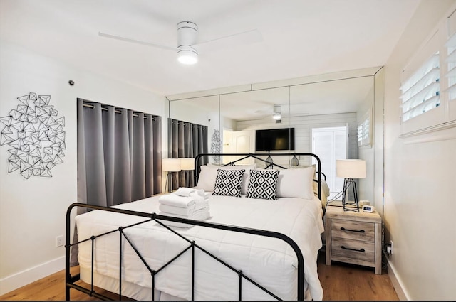 bedroom with ceiling fan and light hardwood / wood-style flooring