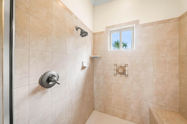 bathroom with tiled shower