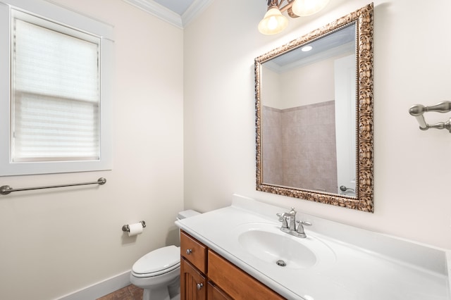 bathroom with crown molding, vanity, toilet, and tile patterned flooring