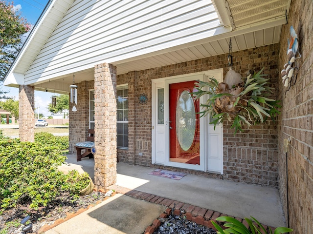 doorway to property featuring covered porch