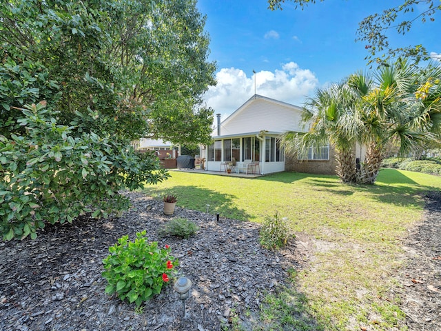 view of yard featuring a sunroom