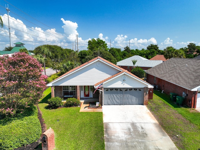 ranch-style home featuring a front lawn and a garage