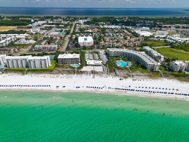 bird's eye view with a water view and a view of the beach