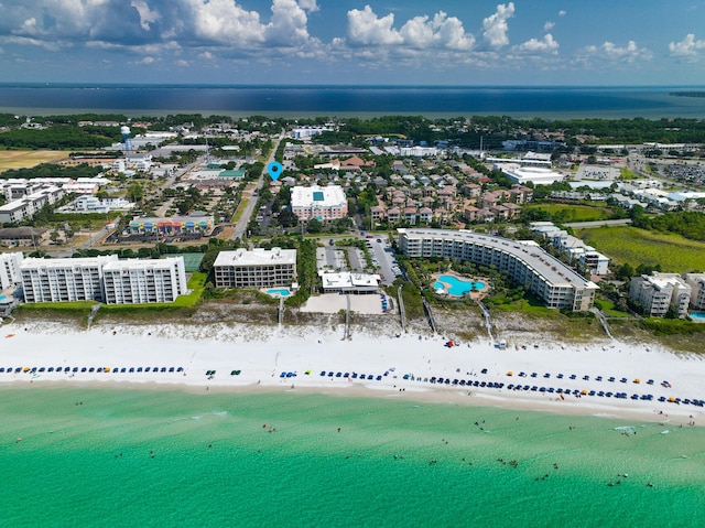 drone / aerial view featuring a water view and a beach view