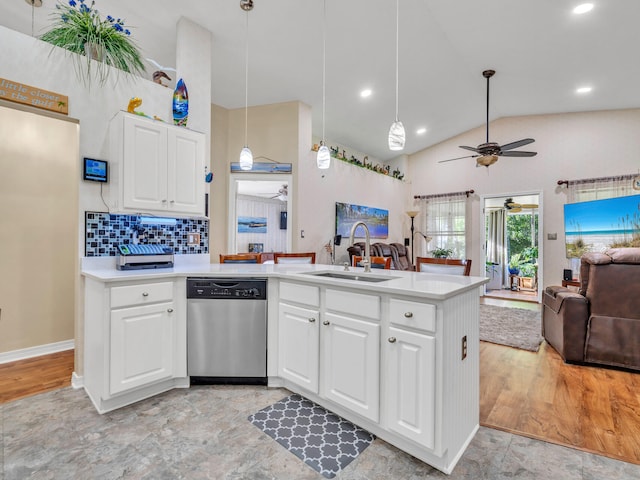 kitchen featuring kitchen peninsula, white cabinetry, dishwasher, and decorative light fixtures