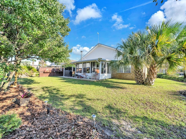 view of yard with a sunroom