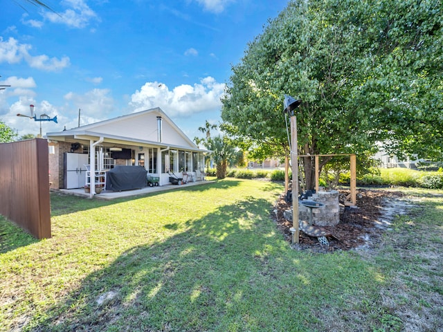 view of yard featuring a patio area and fence