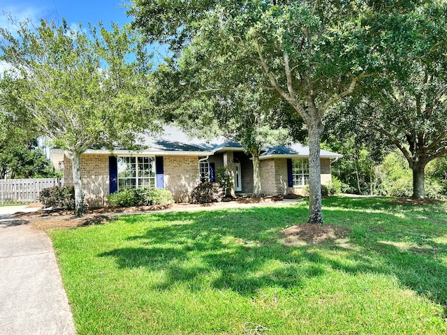 ranch-style house with a front lawn