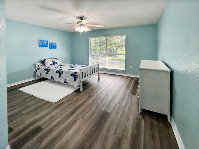 bedroom with hardwood / wood-style floors and ceiling fan