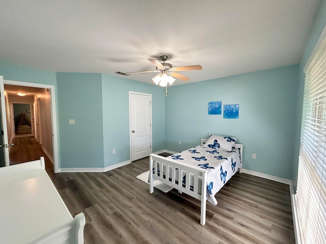 bedroom featuring hardwood / wood-style flooring and ceiling fan