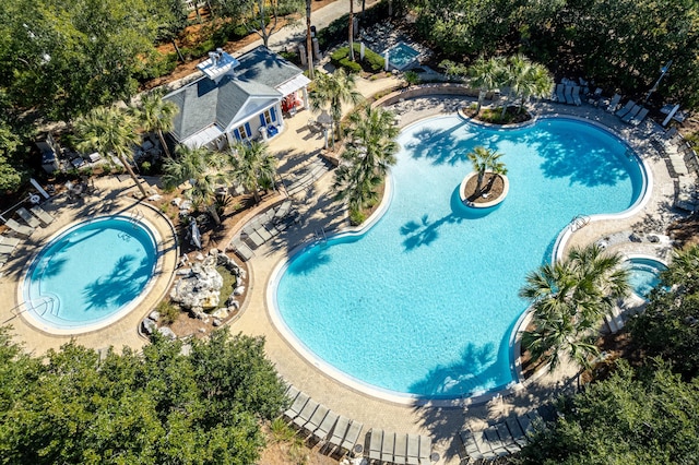 view of swimming pool with a patio and a jacuzzi