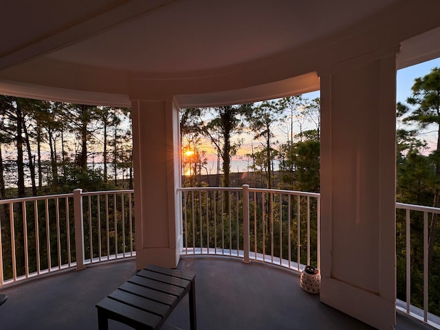 view of balcony at dusk