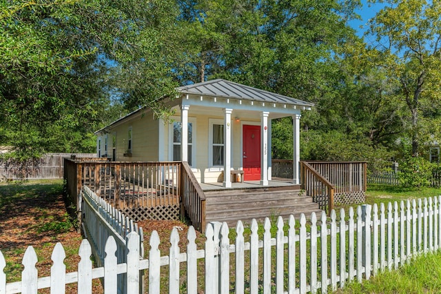 view of front of property with a wooden deck