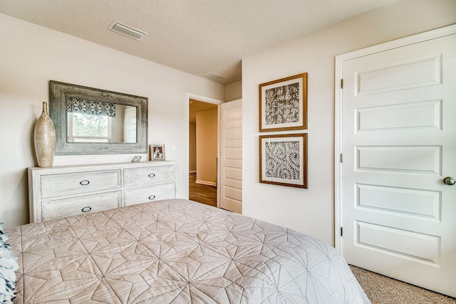 bedroom featuring visible vents