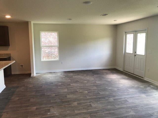 interior space featuring recessed lighting, visible vents, baseboards, french doors, and dark wood finished floors