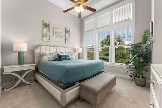 bedroom featuring baseboards, a ceiling fan, and light colored carpet