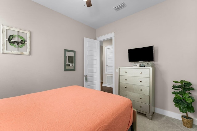 carpeted bedroom featuring visible vents, ceiling fan, and baseboards