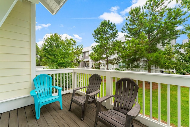 wooden terrace with a yard