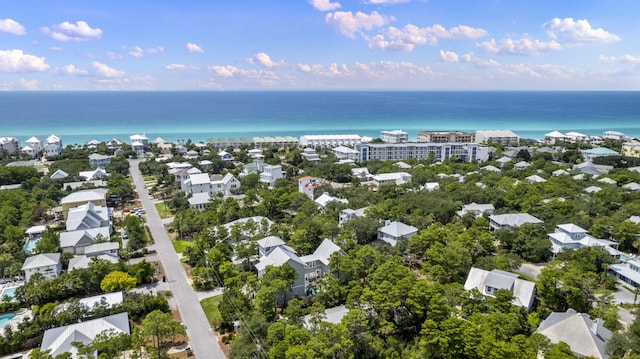 drone / aerial view featuring a water view and a residential view