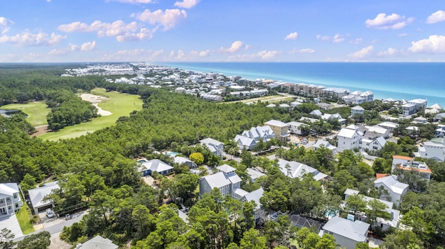 aerial view with view of golf course, a water view, and a residential view