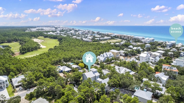 drone / aerial view with view of golf course, a water view, and a residential view