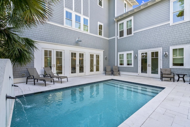 pool featuring a patio and french doors