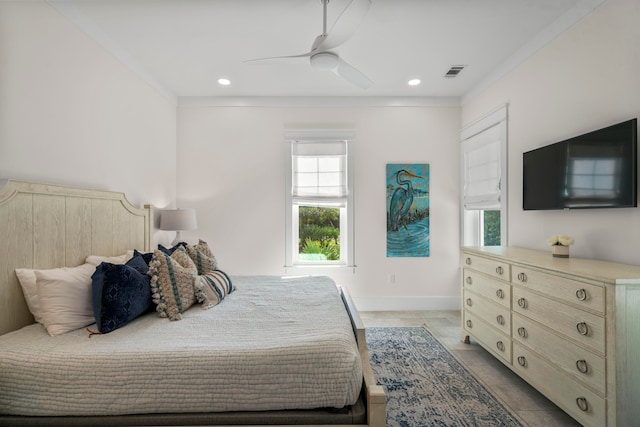 bedroom with ceiling fan and light tile patterned flooring