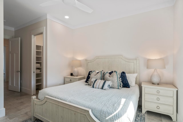 bedroom with ceiling fan, a closet, a walk in closet, and light tile patterned floors