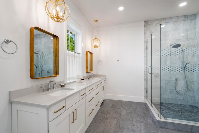 bathroom with tile patterned flooring, a shower with door, vanity, and an inviting chandelier