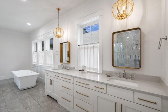 bathroom with a chandelier, double vanity, tiled shower, and a sink