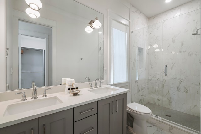 bathroom with tile patterned flooring, an enclosed shower, vanity, and toilet