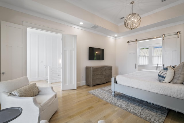 bedroom featuring a chandelier, visible vents, light wood finished floors, and recessed lighting