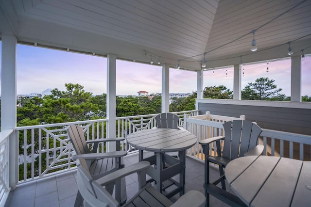 wooden terrace featuring outdoor dining area