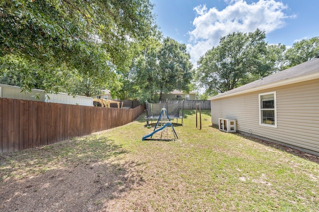 view of yard with a trampoline