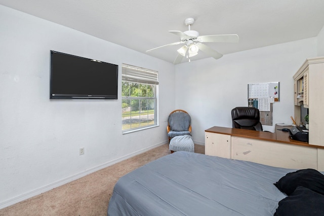 bedroom with ceiling fan and light colored carpet