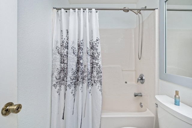 bathroom featuring toilet and shower / tub combo