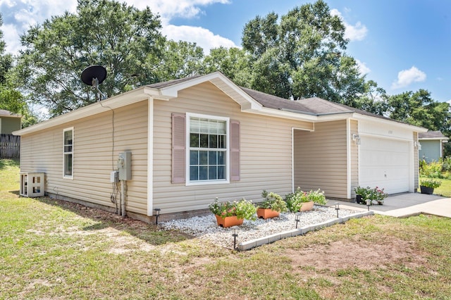 view of front of property featuring a garage and a front lawn