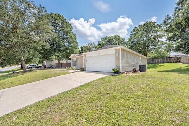 view of front of home featuring a front lawn, central air condition unit, and a garage