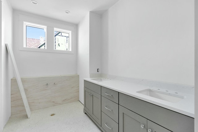 bathroom with tile patterned floors and vanity