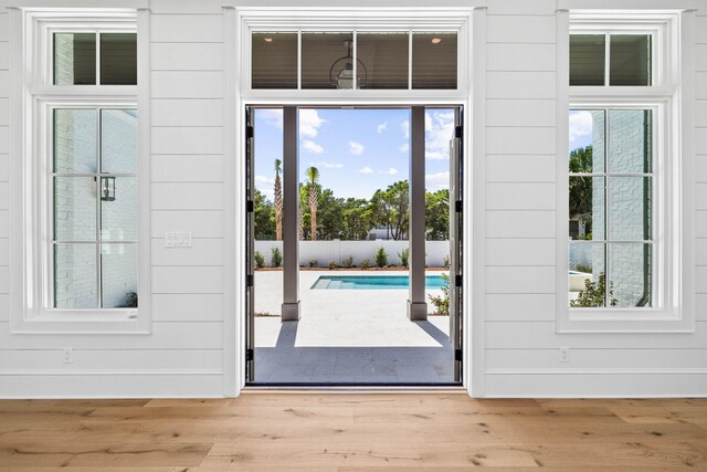 entryway with plenty of natural light and hardwood / wood-style floors