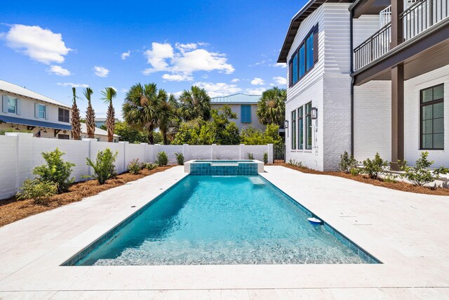 view of swimming pool featuring a patio area