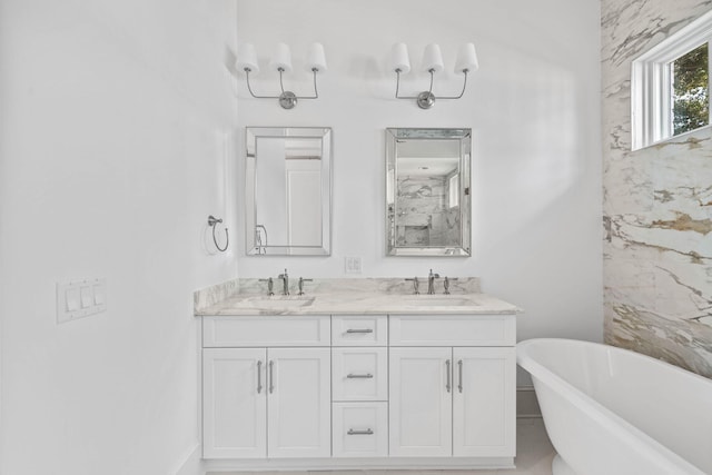 bathroom with vanity and a bathtub