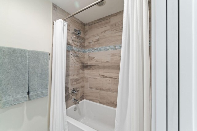 bathroom featuring shower / bath combo with shower curtain