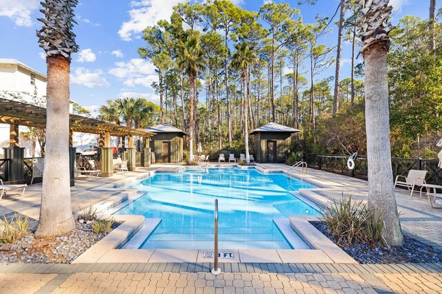 view of swimming pool with a pergola and a patio area