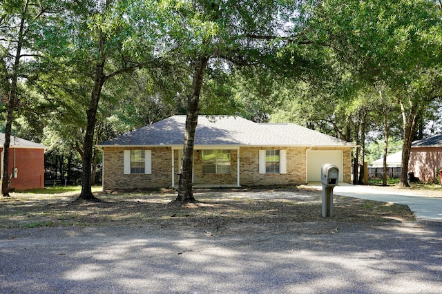 single story home with a garage