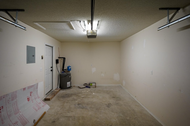 garage with a garage door opener and electric panel