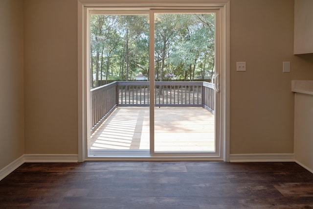 entryway with dark hardwood / wood-style flooring and plenty of natural light