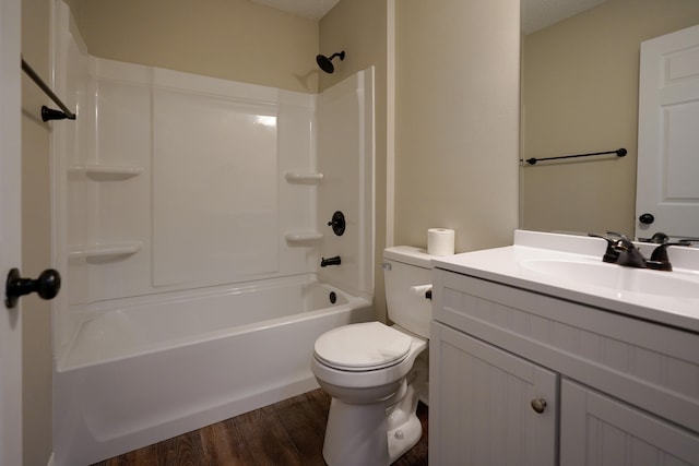 full bathroom featuring toilet, hardwood / wood-style flooring, shower / washtub combination, and vanity